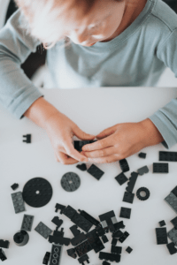 Child playing with Legos