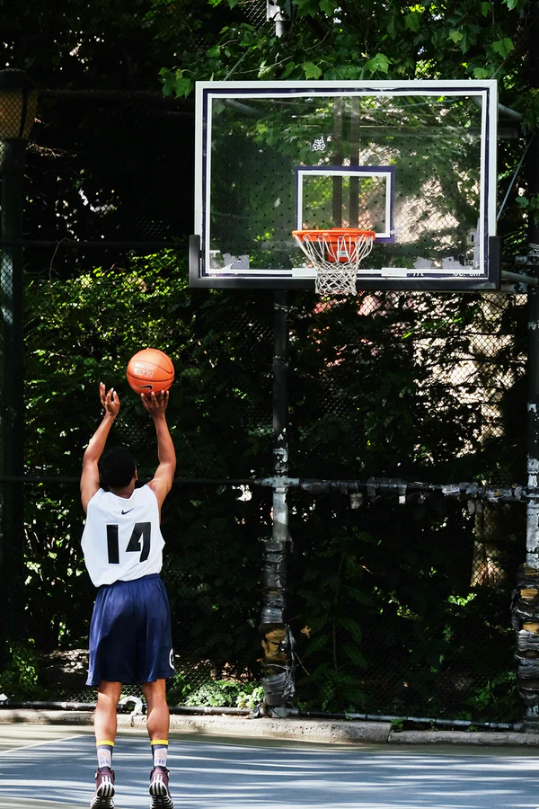 Man shooting basketball